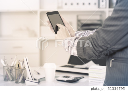 Businesswoman using smartphone Businesswoman using smartphone 31334795