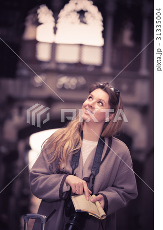 Blond smiling girl holding brochure 31335004