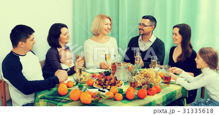 Grandparents congratulating with parents and children 31335618