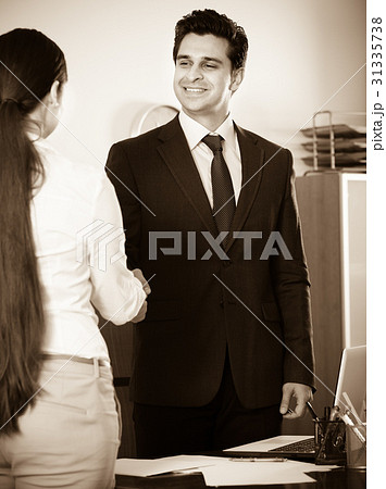 Manager greeting new employee Manager greeting new employee 31335738