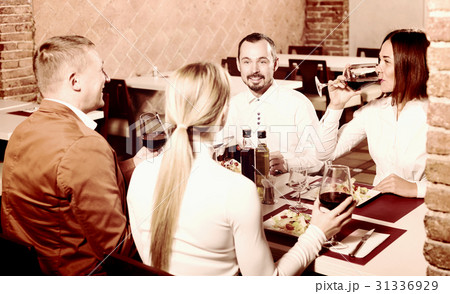 Friends enjoying delicious meal in country restaurant 31336929