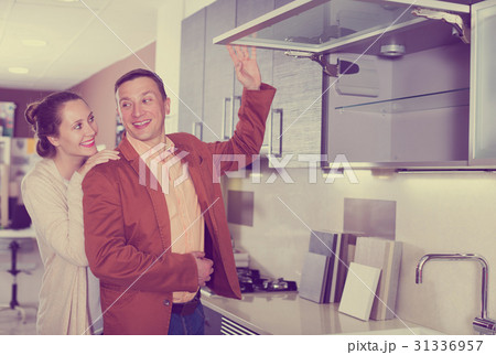 Couple looking at modern kitchen 31336957