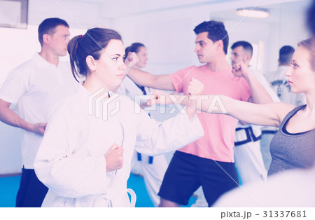 Men and women learn karate 31337681