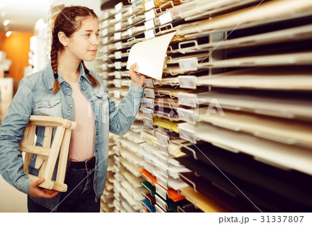 Smiling girl shopping multicolored paper Smiling girl shopping multicolored paper 31337807