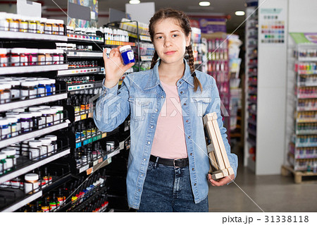 Girl shopping color in glass jar in art store Girl shopping color in glass jar in art store 31338118