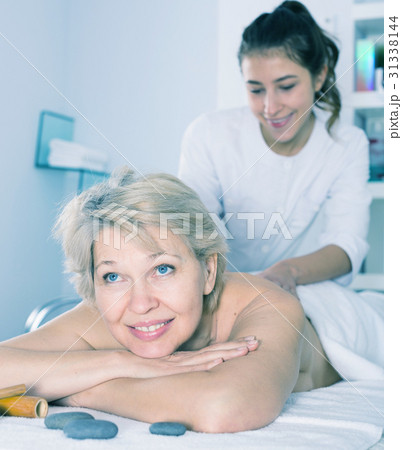 Mature woman having massage 31338144