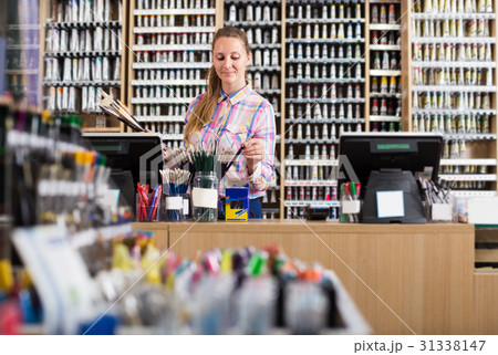 Female seller in art shop 31338147