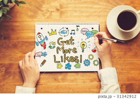 Get More Likes text with a person holding a pen 31342912