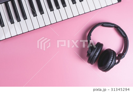 Music Studio Keyboard and Headphone on pink Music Studio Keyboard and Headphone on pink 31345294