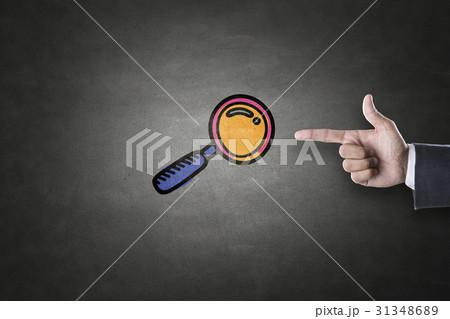 Magnifying glass icon on blackboard 31348689