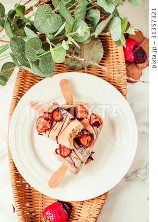 Group of homemade strawberry vanilla popsicles Group of homemade strawberry vanilla popsicles 31357321