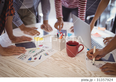Business people working together on office desk 31357924