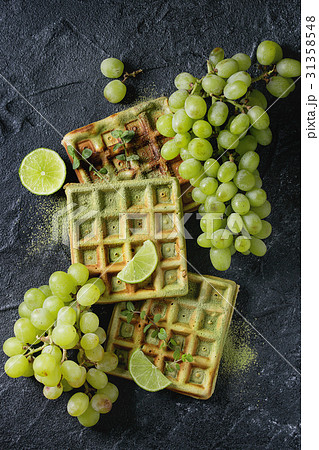 Green waffles with grapes 31358548