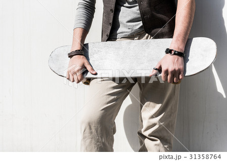 Fashionable guy is resting on street 31358764