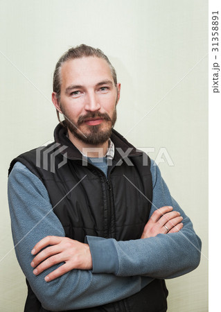 Bearded Asian man above light green wall Bearded Asian man above light green wall 31358891