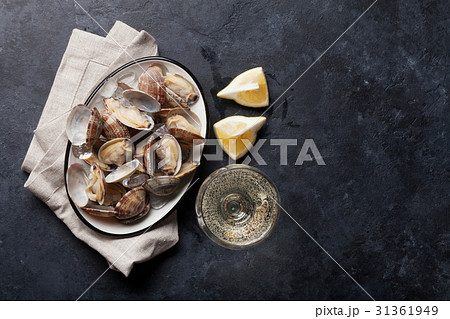 Fresh seafood bowl on stone table. Scallops 31361949