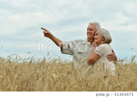 Senior couple on field of wheat 31363073