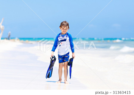 little blond kid boy having fun on tropical beach little blond kid boy having fun on tropical beach 31363415