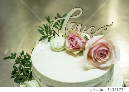 Beautiful wedding cake with cream With text Love 31363724