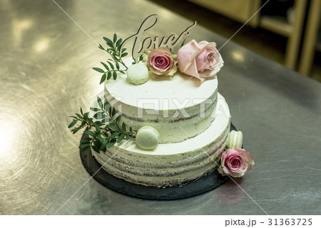 Beautiful wedding cake with cream With text Love Beautiful wedding cake with cream With text Love 31363725