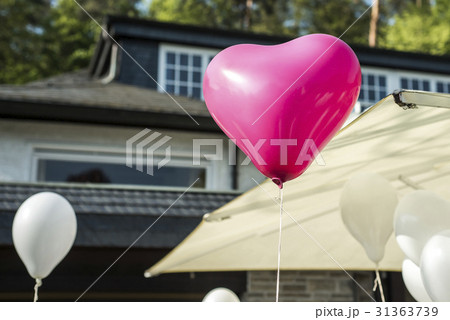 White and pink festive balloons shape of heart White and pink festive balloons shape of heart 31363739
