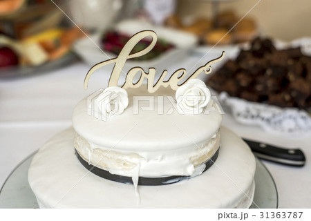 Beautiful wedding cake with cream With text Love 31363787