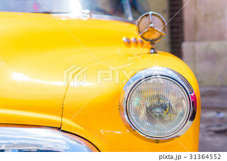 Closeup of yellow classic vintage car in Old Closeup of yellow classic vintage car in Old 31364552