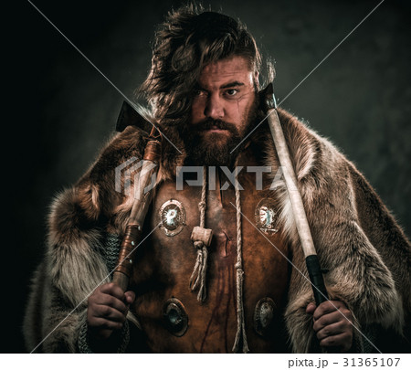 Viking with cold weapon in a traditional warrior Viking with cold weapon in a traditional warrior 31365107