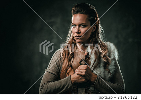 Viking woman with cold weapon in a traditional Viking woman with cold weapon in a traditional 31365122