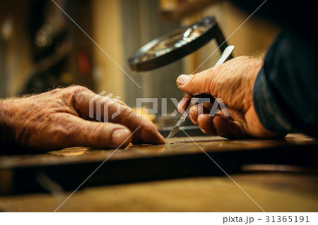 Senior wood carving professional during work 31365191