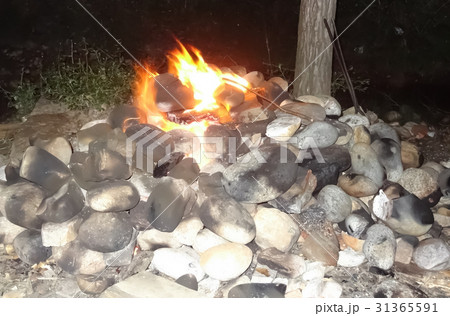 Burning stones for boiling water bath in Bhutan. 31365591