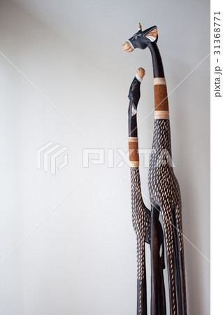 Scrimshaw giraffes from the tree in front of a Scrimshaw giraffes from the tree in front of a 31368771