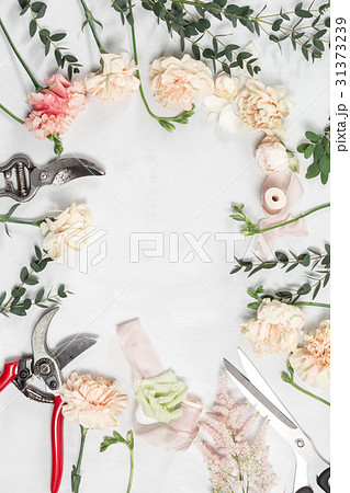 The florist work table with tools on gray wooden 31373239