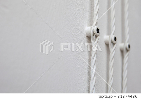 Vintage wiring on white wall, electric wire Vintage wiring on white wall, electric wire 31374436