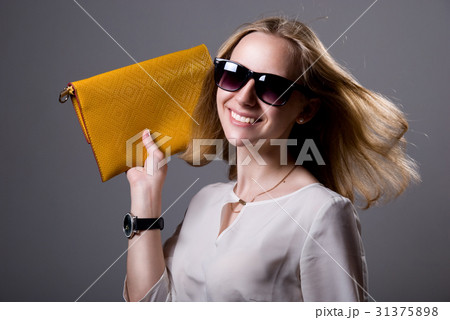 Portrait of cheerful beautiful girl in sunglasses 31375898