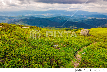 footpath down the hill through mountain ridge 31379202
