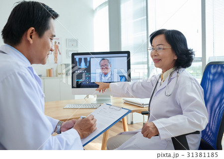 Video Conference Meeting at Doctors Office 31381185