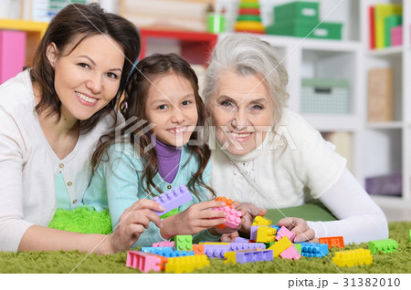 girl with mother and grandmother 31382010
