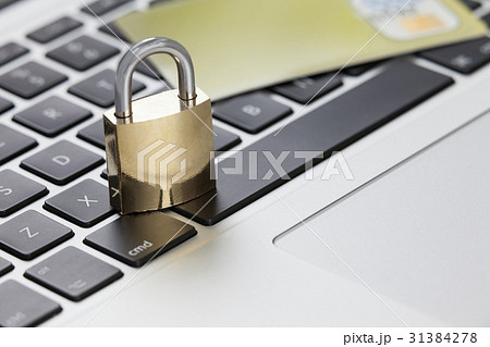 Metallic lock with smart card on laptop Metallic lock with smart card on laptop 31384278