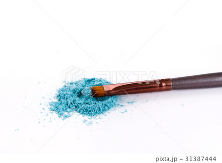 Makeup brush background with eyeshadow sprinkled Makeup brush background with eyeshadow sprinkled 31387444