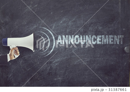Megaphone with announcement sign on blackboard 31387661