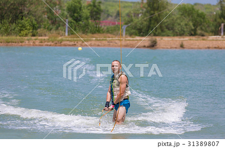 Man study wakeboarding on a blue lake 31389807