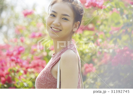 Happy young woman is in a garden 31392745