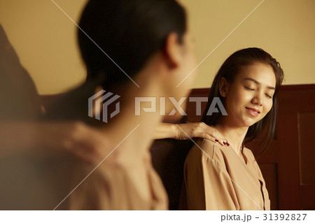 Two women are enjoying shoulder massage in spa salon. 31392827