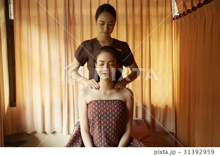 Attractive young woman is getting shoulder massage in spa Attractive young woman is getting shoulder massage in spa 31392959