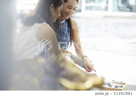 Two girls are happily choosing fingertips 31392981