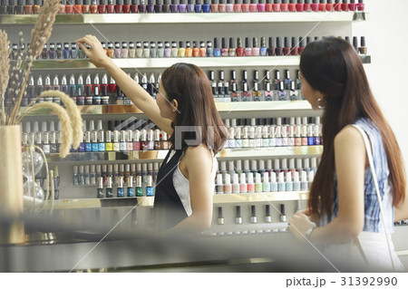 A sale girl is talking the product for a female customer A sale girl is talking the product for a female customer 31392990
