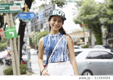 a portrait of a young girl in hiphop style standing and smiling 31393004