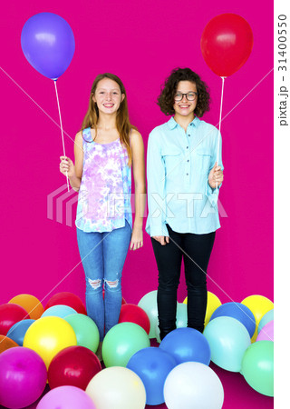 Young Adult Women Holding Balloons Together Studio Portrait 31400550