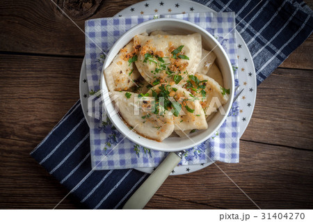 Dumplings with meat, onion and bacon. 31404270